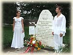 Laying flowers at the monument at the first bury place of Rezanov